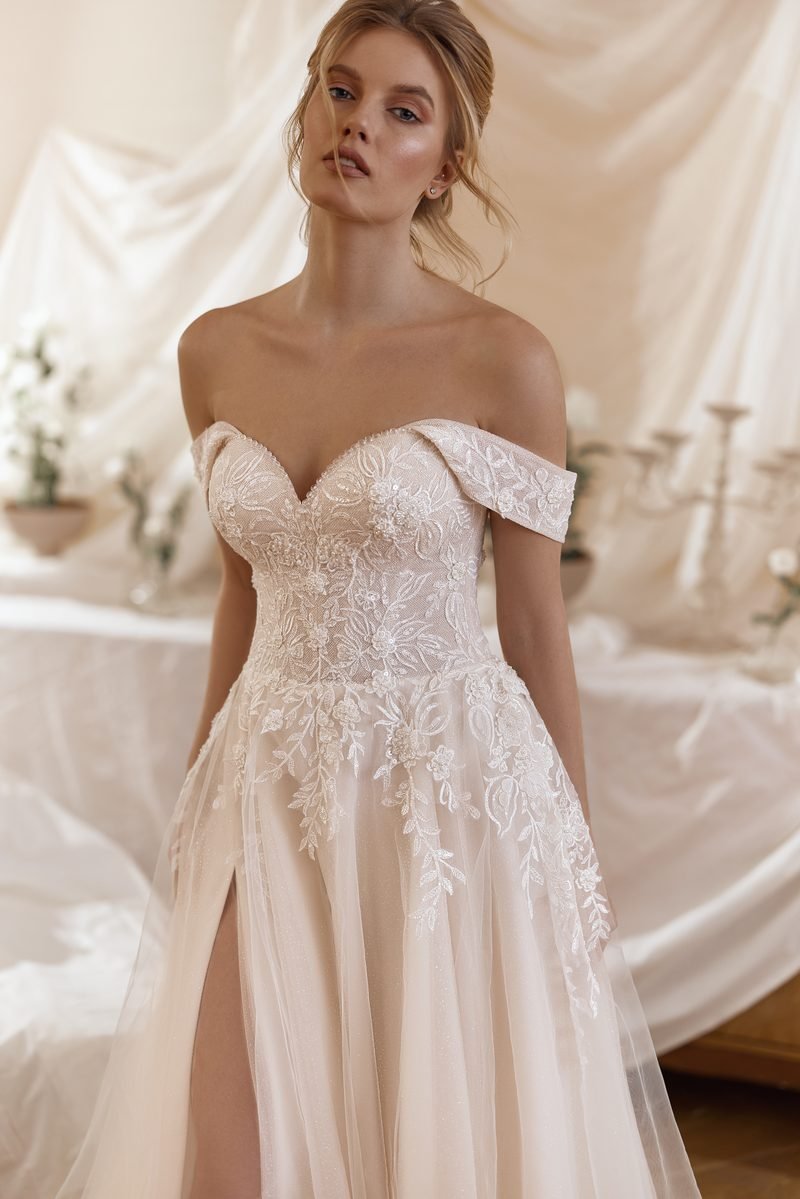 Wedding dress, a-line or ball-gown volume, off the shoulder, with a slit — the Alicia model, view 3, MADAMOON showroom, Paris 10e