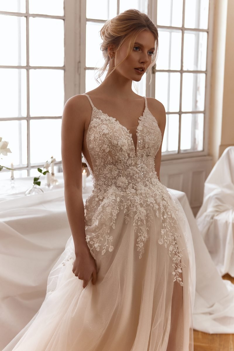 Wedding dress, a-line or ball-gown volume, delicate lace, V-neck corset and a slit — the Lovia model, view 3, MADAMOON showroom, Paris 10e